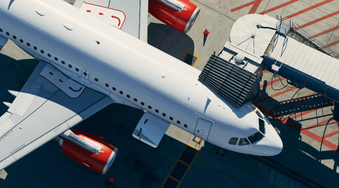 Arial view of an air bridge connected to an aeroplane